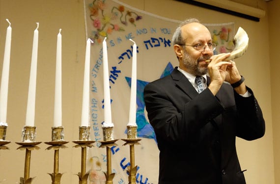 Rabbi Peter Schweitzer blowing the Shofar on Rosh Hashanah