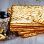 A Seder plate at Passover on a tablecloth